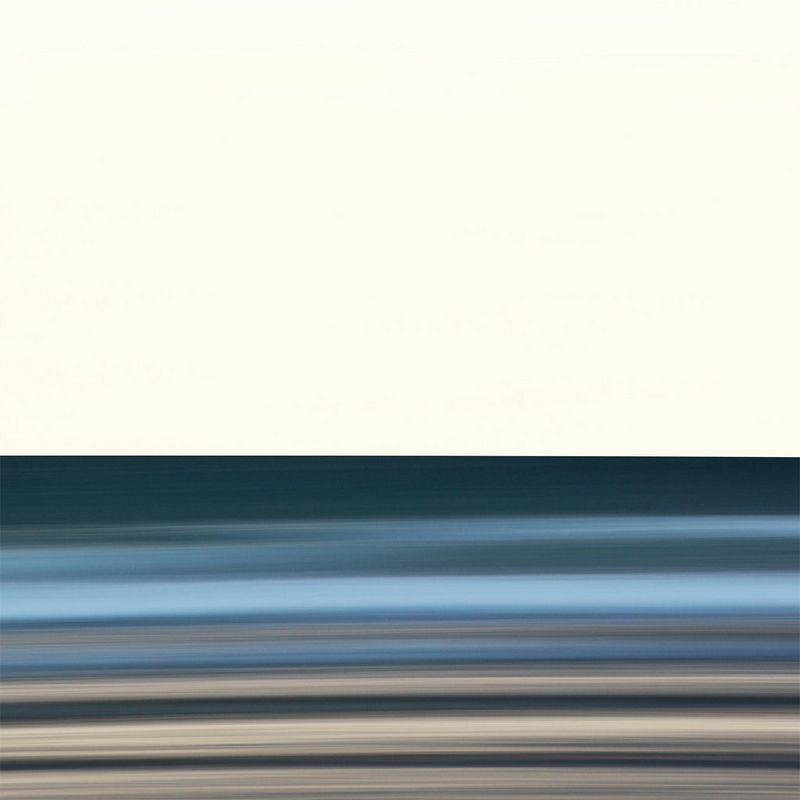An abstract shot of a beach scene, the colours blurred. 