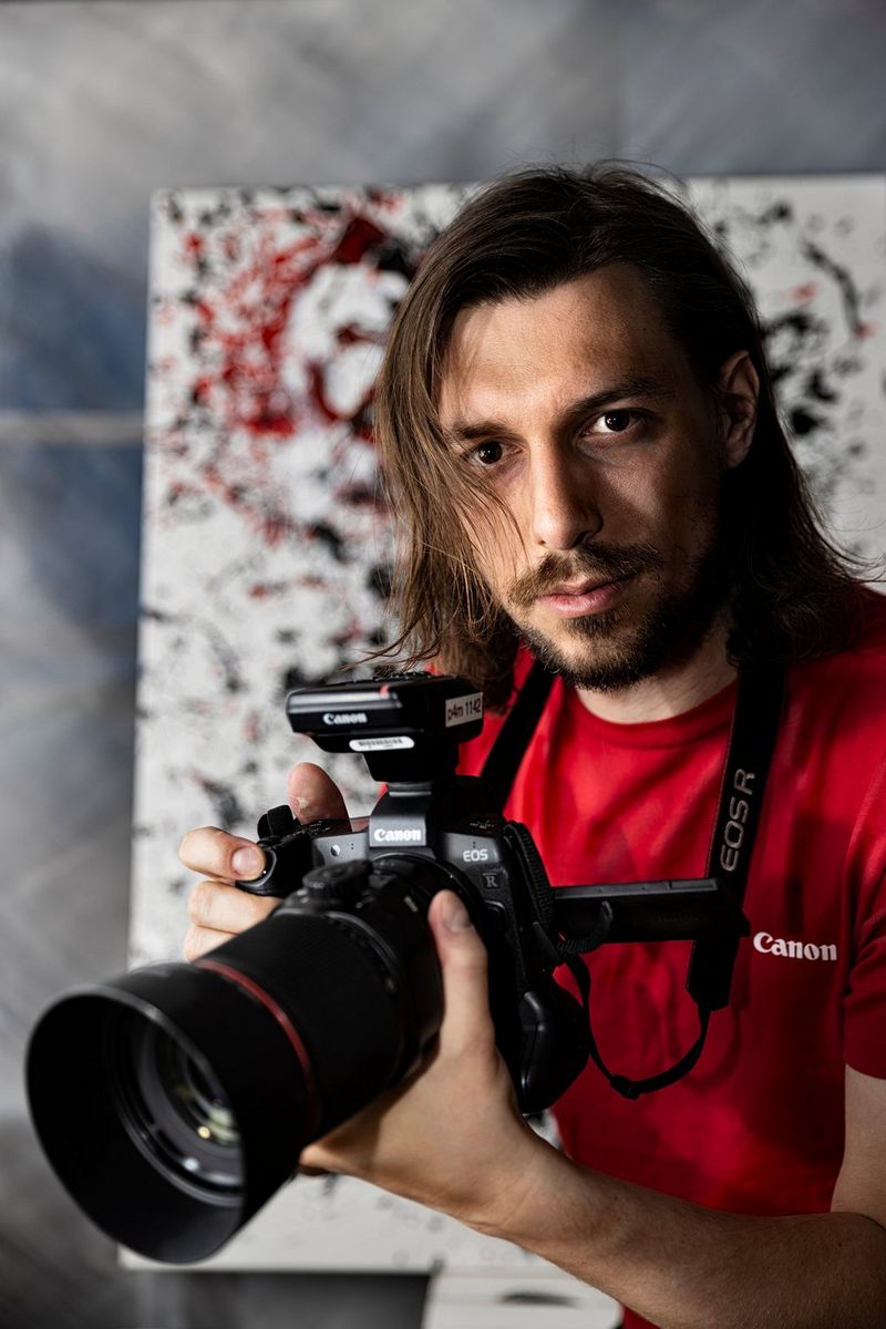 Photographer Robert Lösch with his Canon kit.