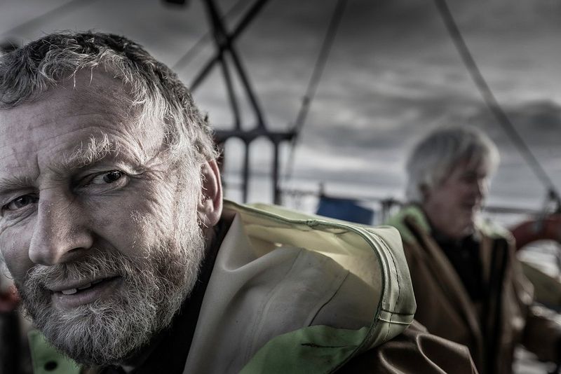 A portrait of fisherman John Baker on his boat. 