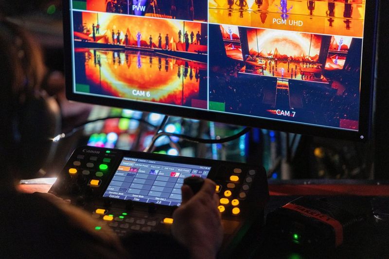 A close-up of Harriet Woollam operating the Canon PTZ cameras via the RC-IP1000 controller during a Kylie Minogue live performance.