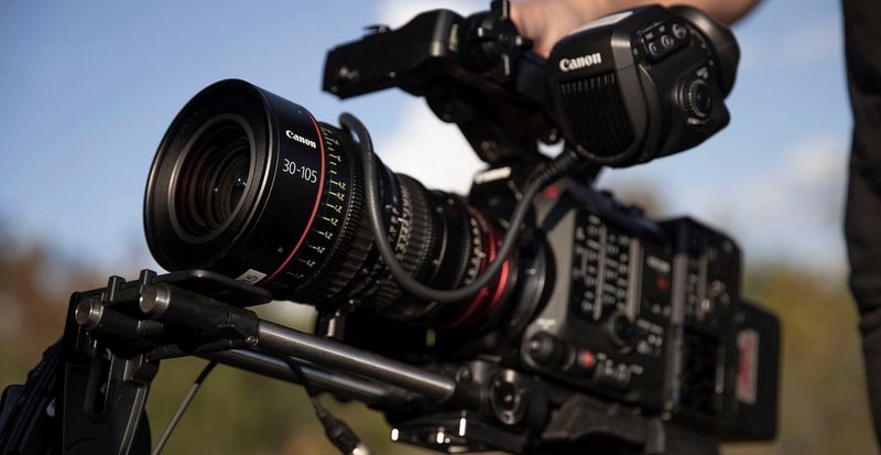 A Canon Cinema EOS camera with a 30-105mm lens. 