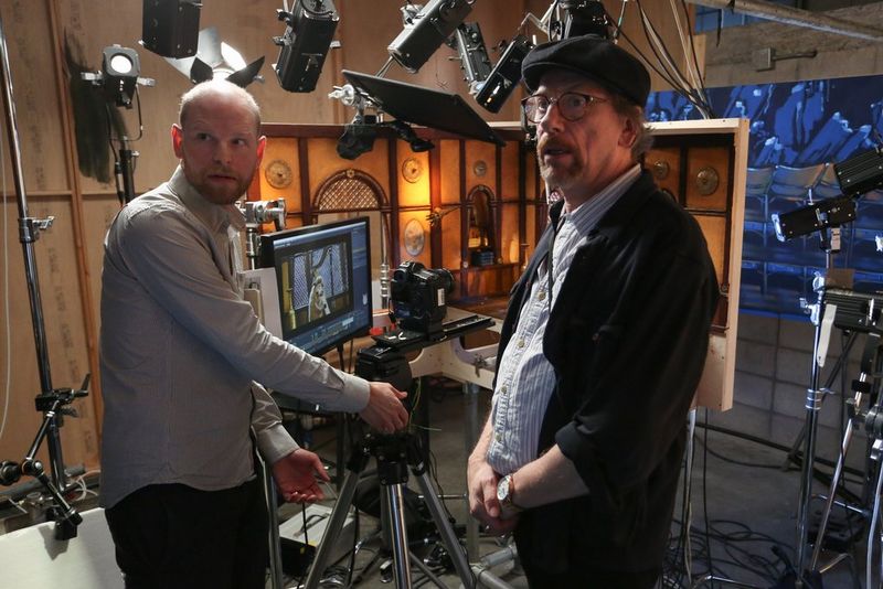 Cinematographer Dave Alex Riddett (right) stands on the set of stop motion animation early man.