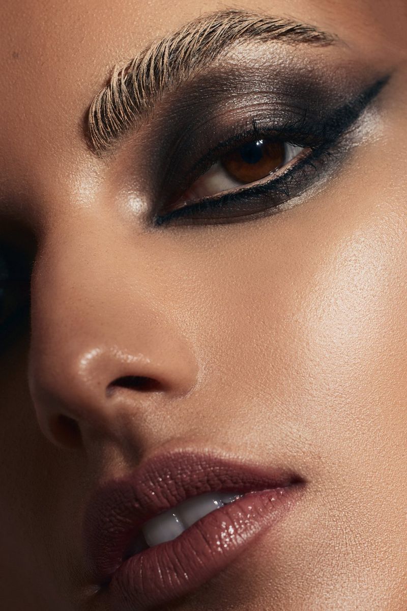 A close-up of a model's face, framing the mouth, nose and left eye, taken on a Canon EOS R5.