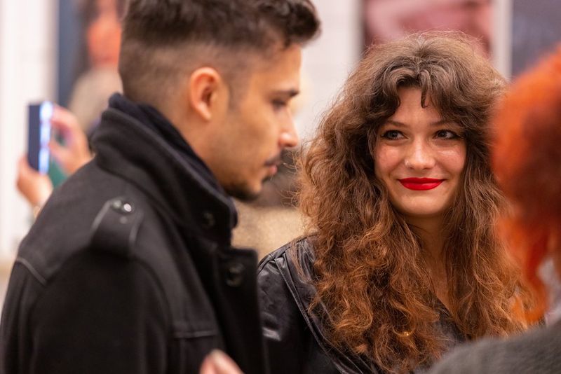Fashion photographer Wanda Martin smiles at a guest during the opening of her exhibition in Budapest. 