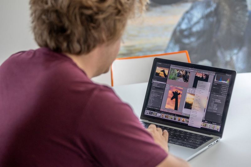 Timo Beke viewing a library of his wildlife photographs on his laptop prior to printing them wirelessly using a Canon A2 printer.   