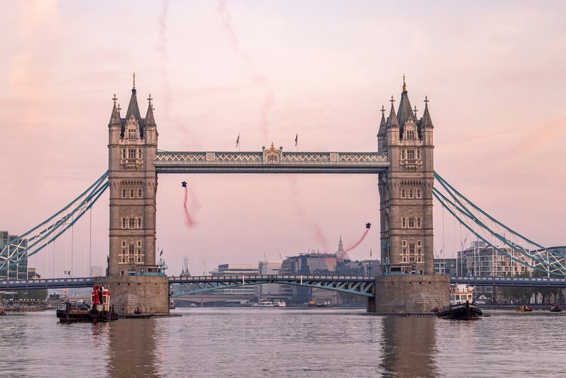 Wingsuiters Marco Fürst and Marco Waltenspiel captured in their flight through London's defining landmark Tower Bridge, shot on Canon.