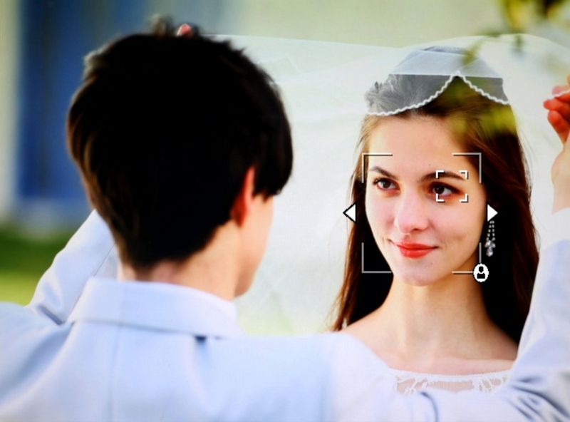 The view in a Canon EOS R3 viewfinder showing the Register people priority feature being used to register the face of a bride at a wedding.