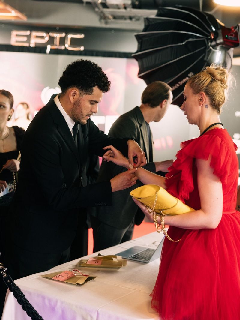 An audience member receives a wristband while attending independent film screenings at Raindance Film Festival 2026