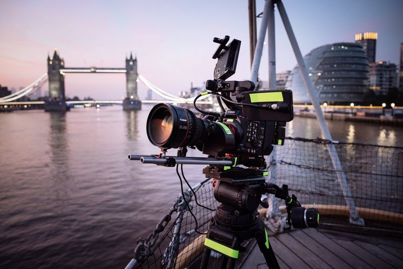 A Canon EOS C300 Mark III with a CN10X25 IAS S lens set up to capture the Red Bull wingsuit flight, with Tower Bridge and London City Hall in the background.