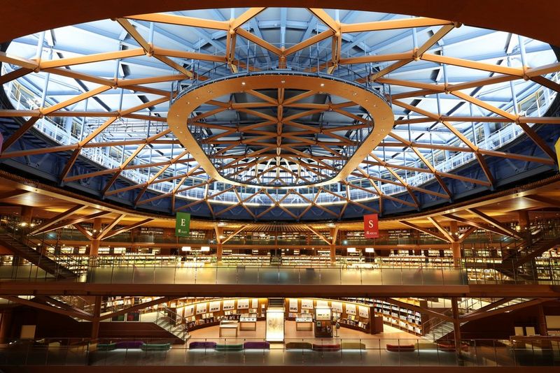The intricate ceiling design of a library in Japan, captured with a Canon RF 20mm F1.4L VCM ultra-wide lens. 