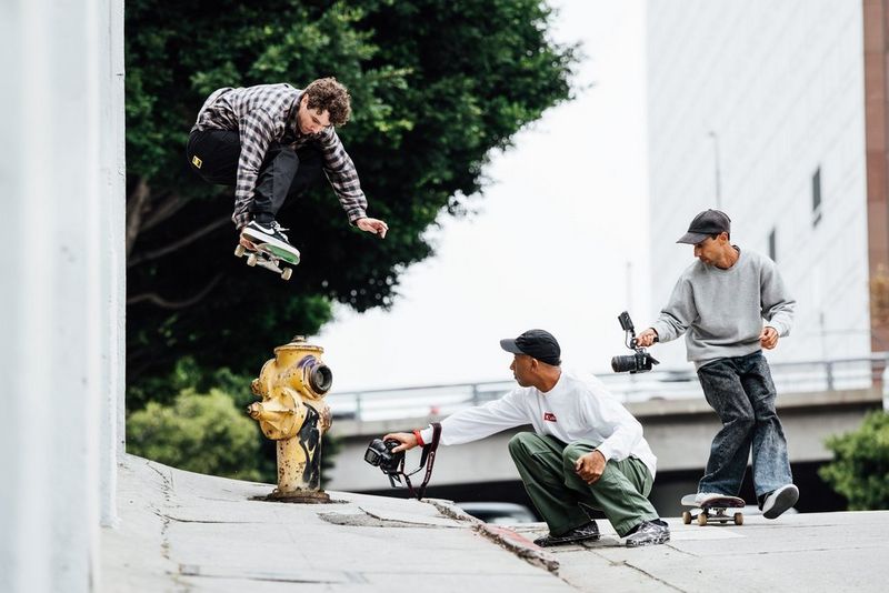  Photographer Atiba Jefferson shoots from a low angle with a Canon fisheye lens as a skateboarder performs an aerial trick above him.