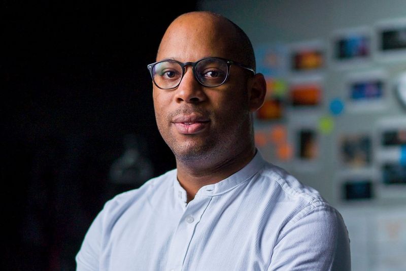A portrait photograph of director Simeon Quarrie.