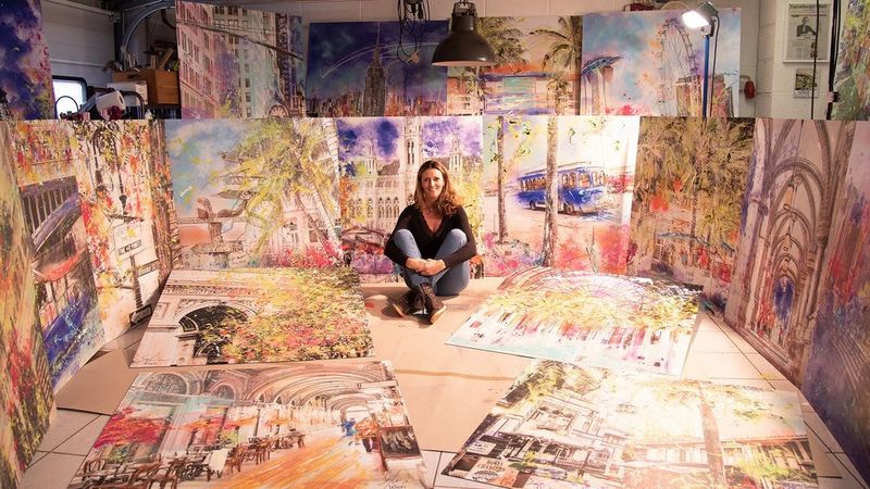 Sophia Rein's sitting amongst her large format graphics print outs - Canon UK