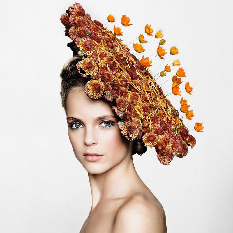 A woman with a huge flower headpiece