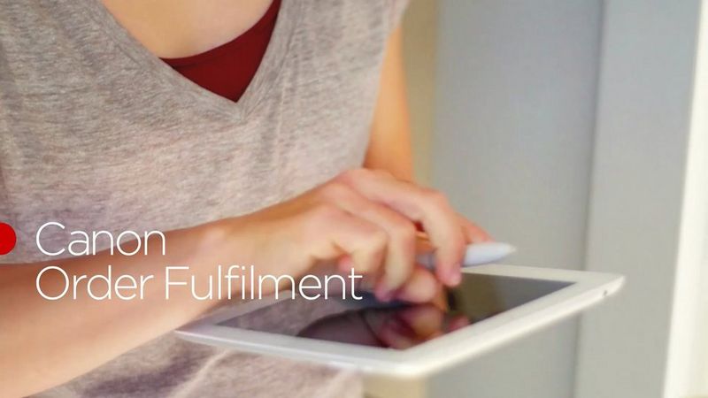 Cartoon-style graphic of an office, with blond woman, dark haired man and a dog among desks and a filing cabinet with a plant on top。