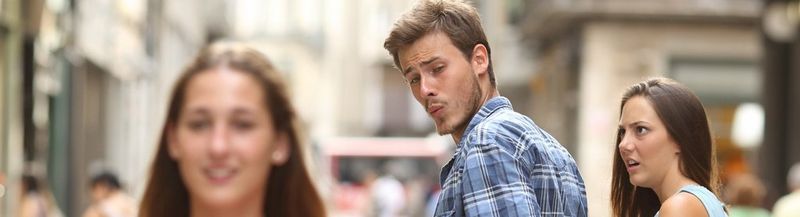 The original famous ‘distracted boyfriend’ image of a young man looking admiringly over his shoulder at a young woman as he walks with his girlfriend. ©<a href="http://antonioguillem.com/"> Antonio Guillem</a>