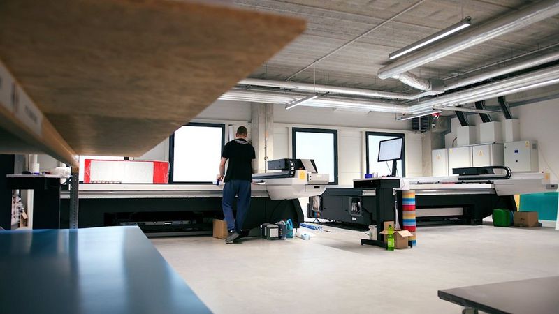 Visual Promotions representative operating  a Canon large format printer