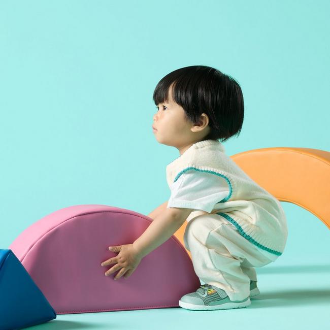 baby wearing clarks harbour hero with soft play blocks