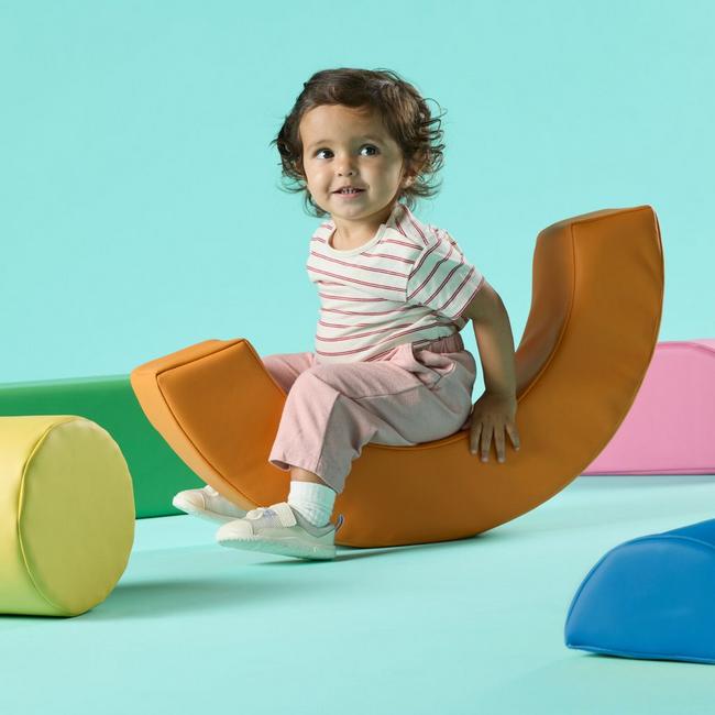 toddler wearing Harbour hero shoes on soft play blocks