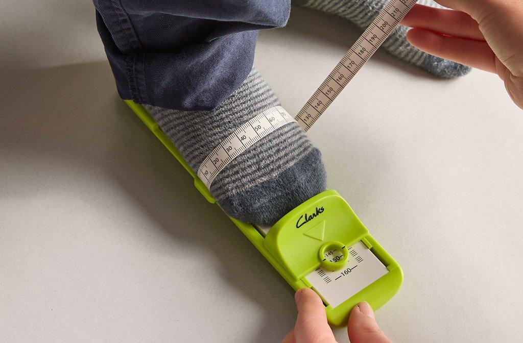 A Footgauge being used to measure a child's foot