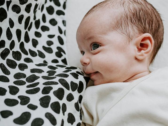 Baby snuggled in Etta Loves blanket