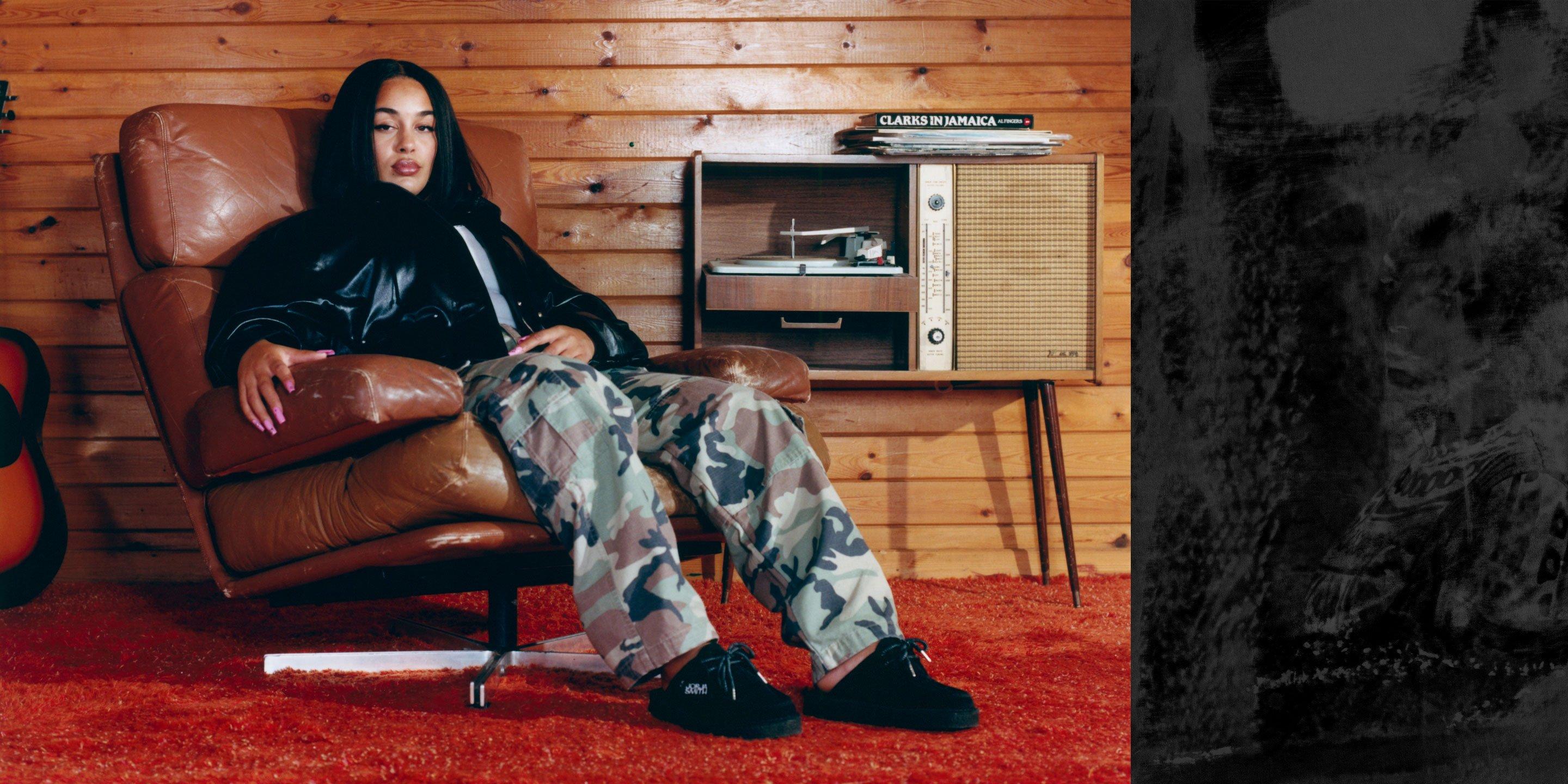 Jorja Smith sat wearing her brand-new silhouette inspired by our iconic Desert Nomad