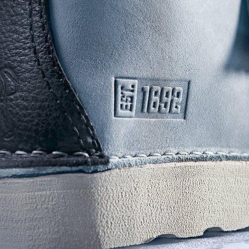 Close up of 'Est.1692' stamp on the grey Raheem Sterling Trek Hi