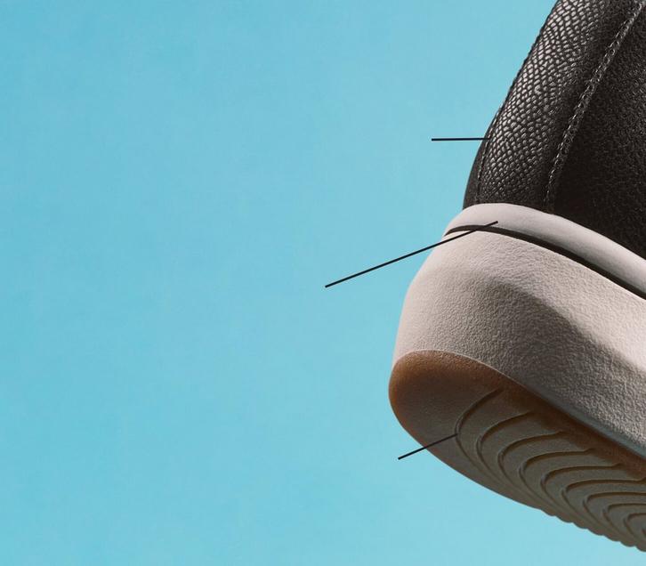 Side view of the heel of a Clarks Breeze Derby shoe on a turquoise background