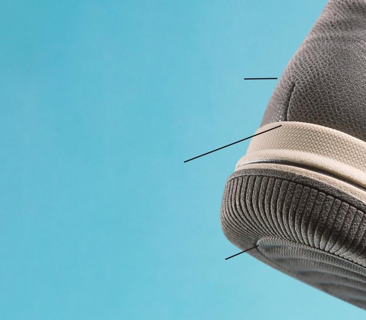 Side view of the heel of a Clarks BreezeSky shoe on a turquoise background