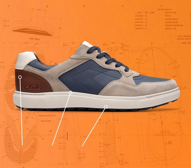 Side view of a Clarks Mapstone trainer on an orange background