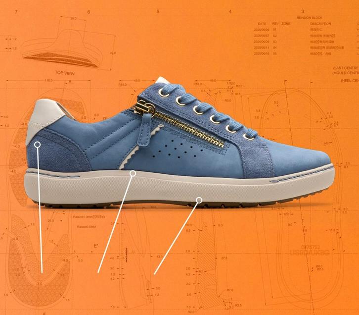 Side view of a Clarks Nalle Zen shoe on an orange background