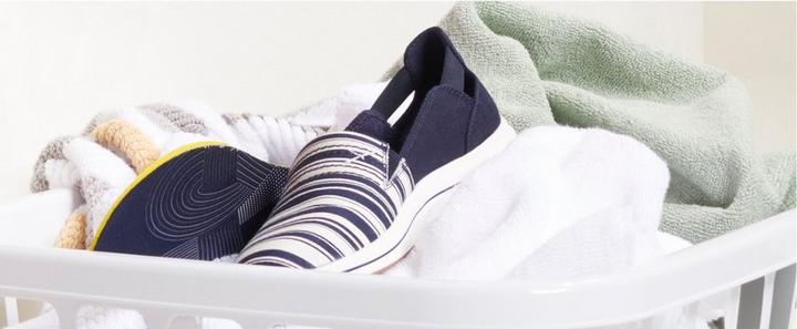 Breeze shoe in a laundry basket along with other fabrics. 