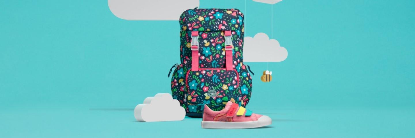 Backpack from the Frugi kids Accessories collection on a blue background