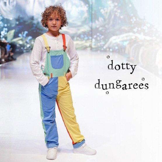 Child wearing colourful patchwork Dotty Dungarees dungarees