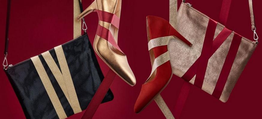 Stylised shot of women’s gold and red heels, with matching gold and black bags