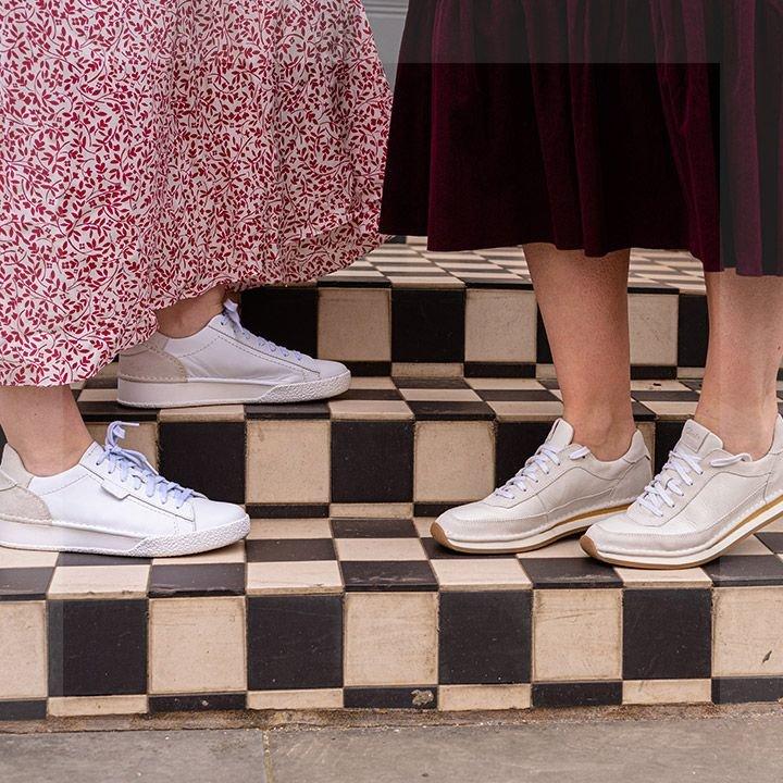 Close up of both Beulah founders feet wearing Clarks shoes