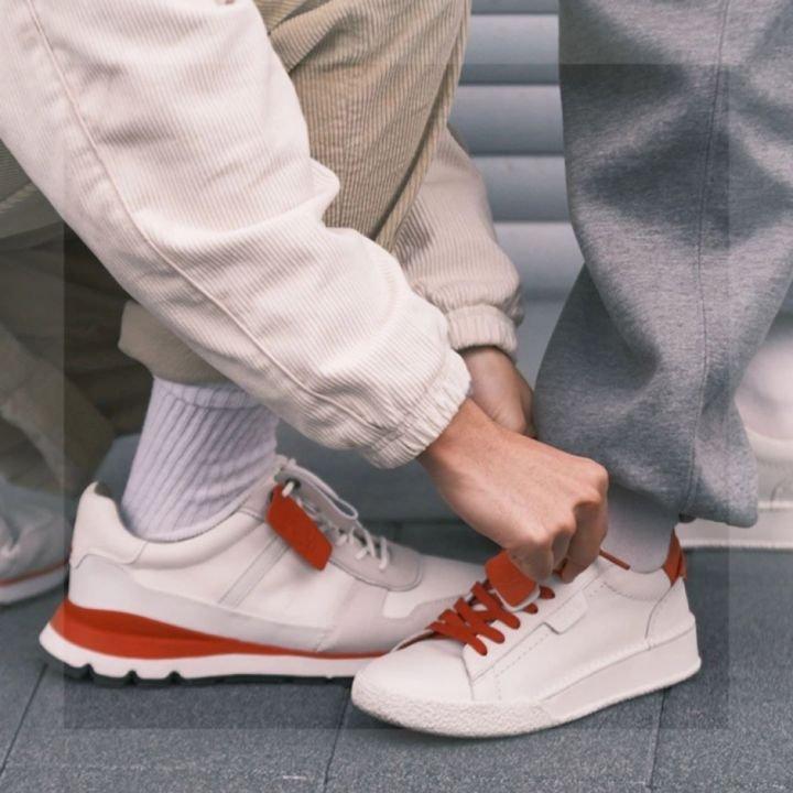 Two trainers facing eachother while worn