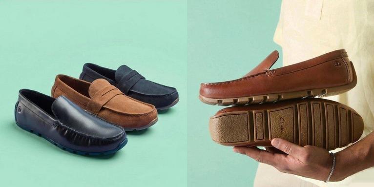 Man holding Corsley Plain leather driving loafers