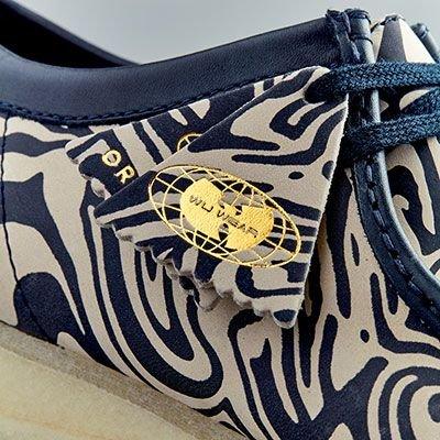 Close-up of blue and cream Wu Wear Wallabee fob