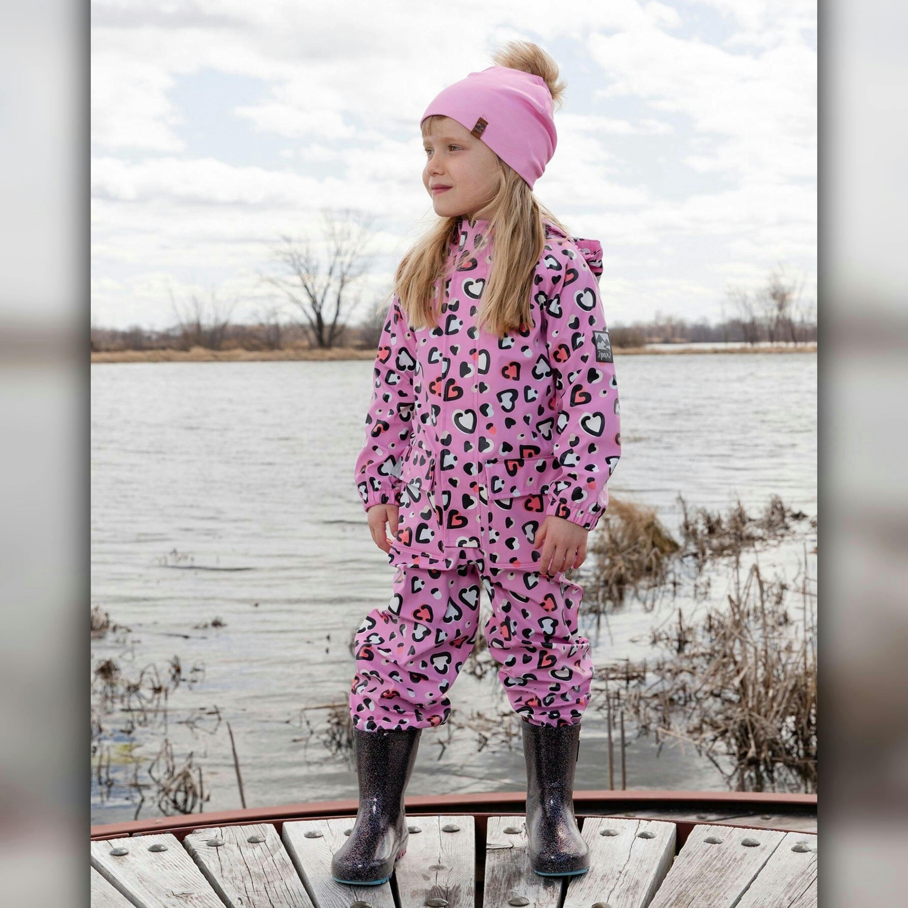 Pink rain jumpsuit with color-changing hearts print , view 2 of 5