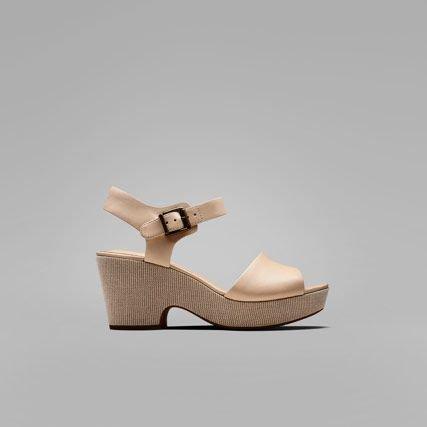 Nude leather womens sandals with a subtle pattern on the chunky sole