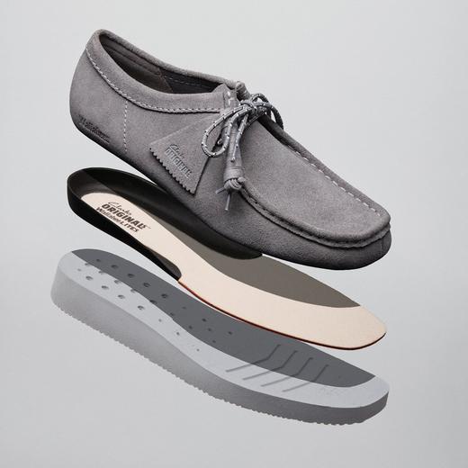 Exploded construction view of a grey Wallabee Lite shoe