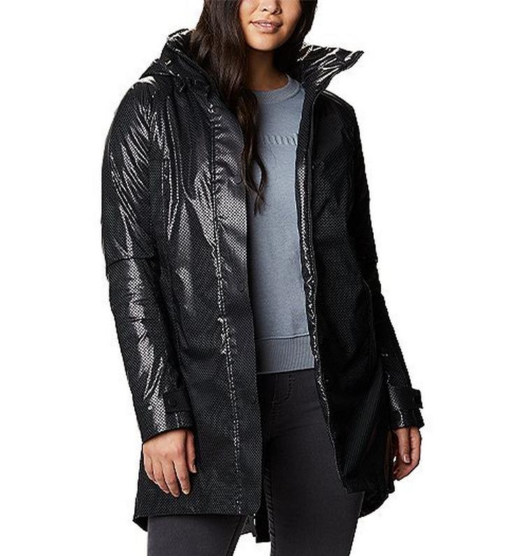 Woman wearing an Omni heat Black Dot jacket.