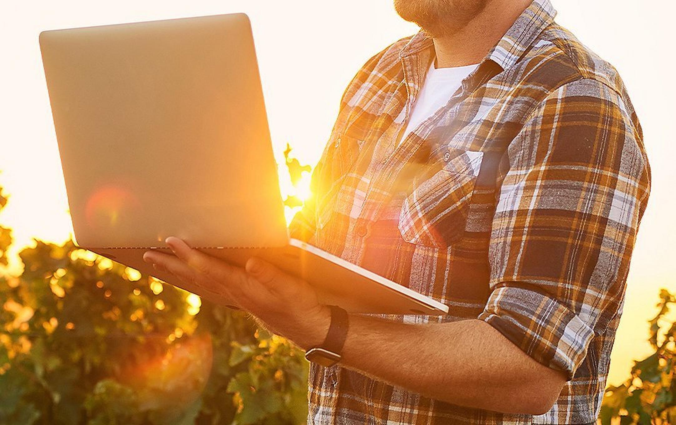 Man holding a laptop.