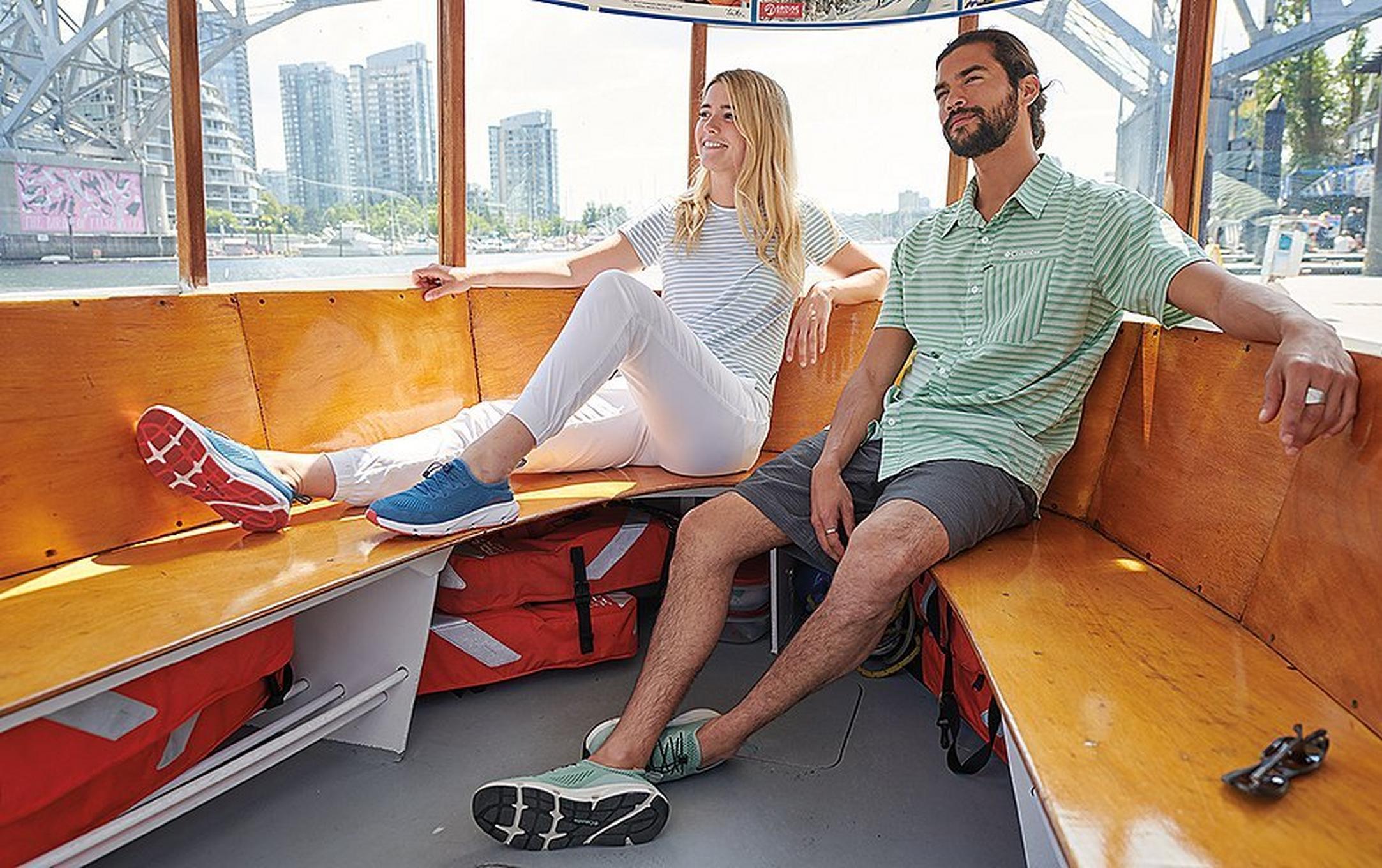 Couple lounging on a boat on a river cruise.