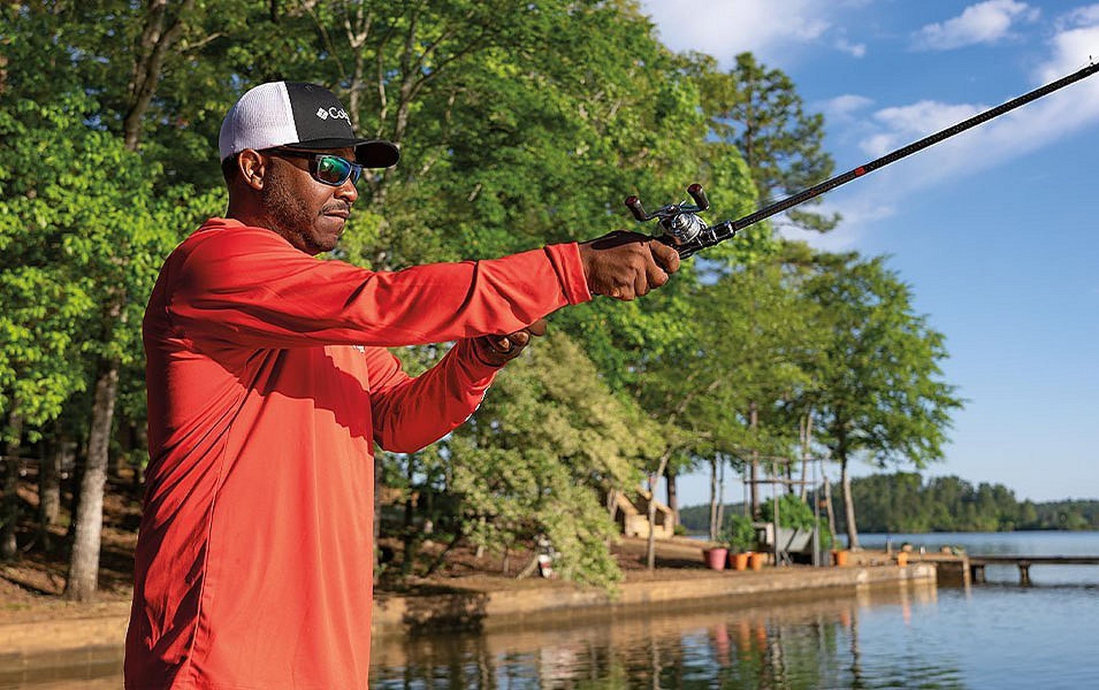 Pro angler Mark Daniels Jr. casts a fishing line into the water on a beautiful sunny day.