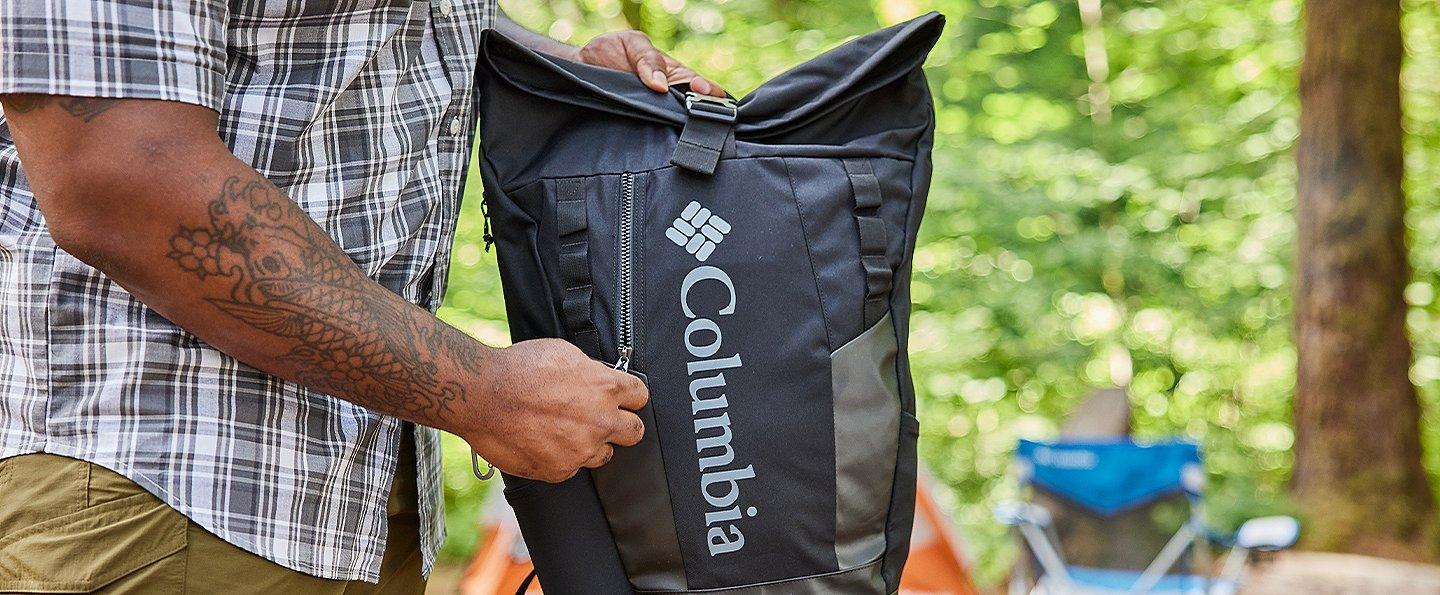 Person holding a Columbia backpack.