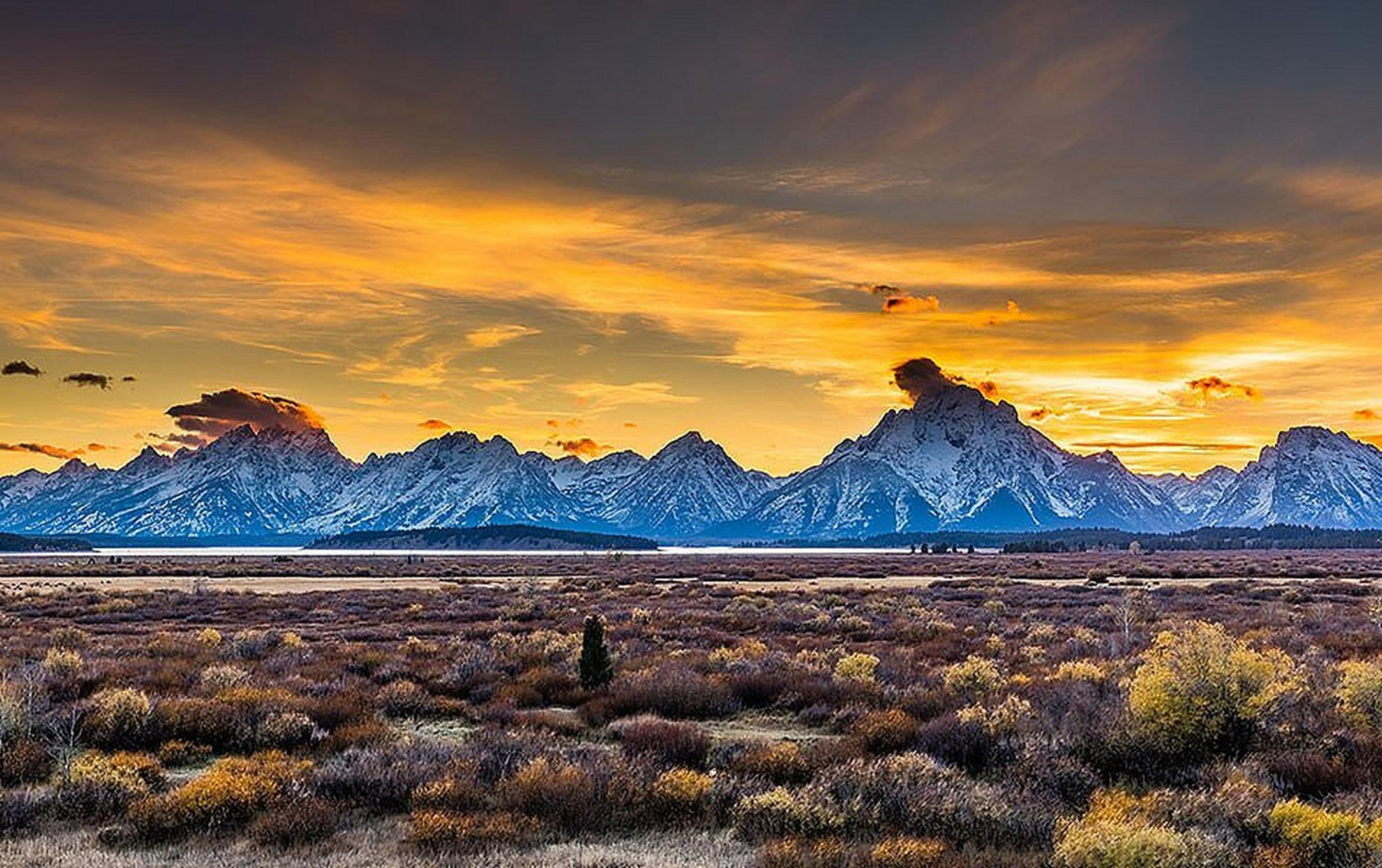 A gorgeous expanse of mountains is pictured in the distance at Wyoming’s Grand Teton National Park.