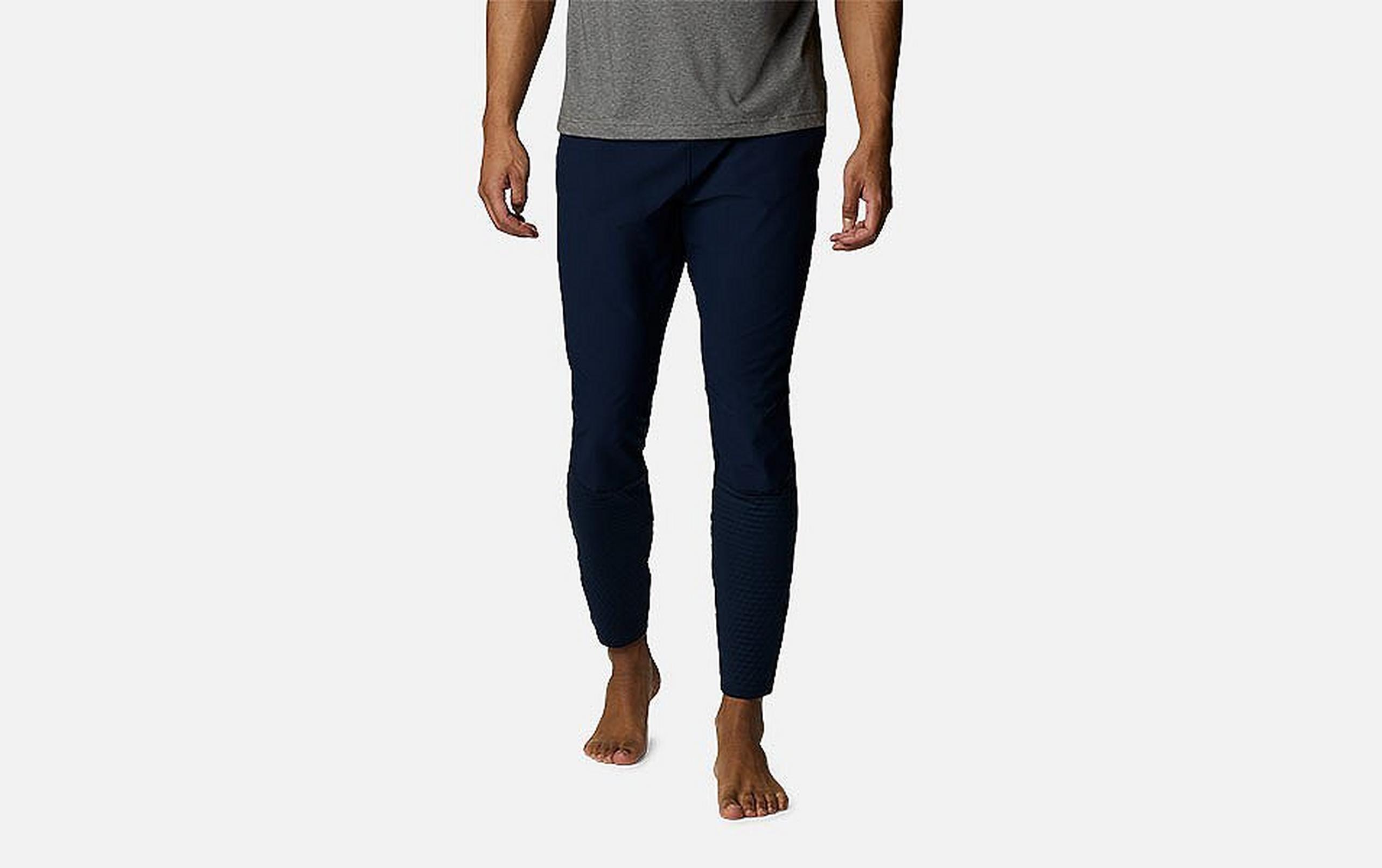 A product image of a man wearing Columbia Sportswear’s Bliss Ascent Hybrid Pants against a white background.