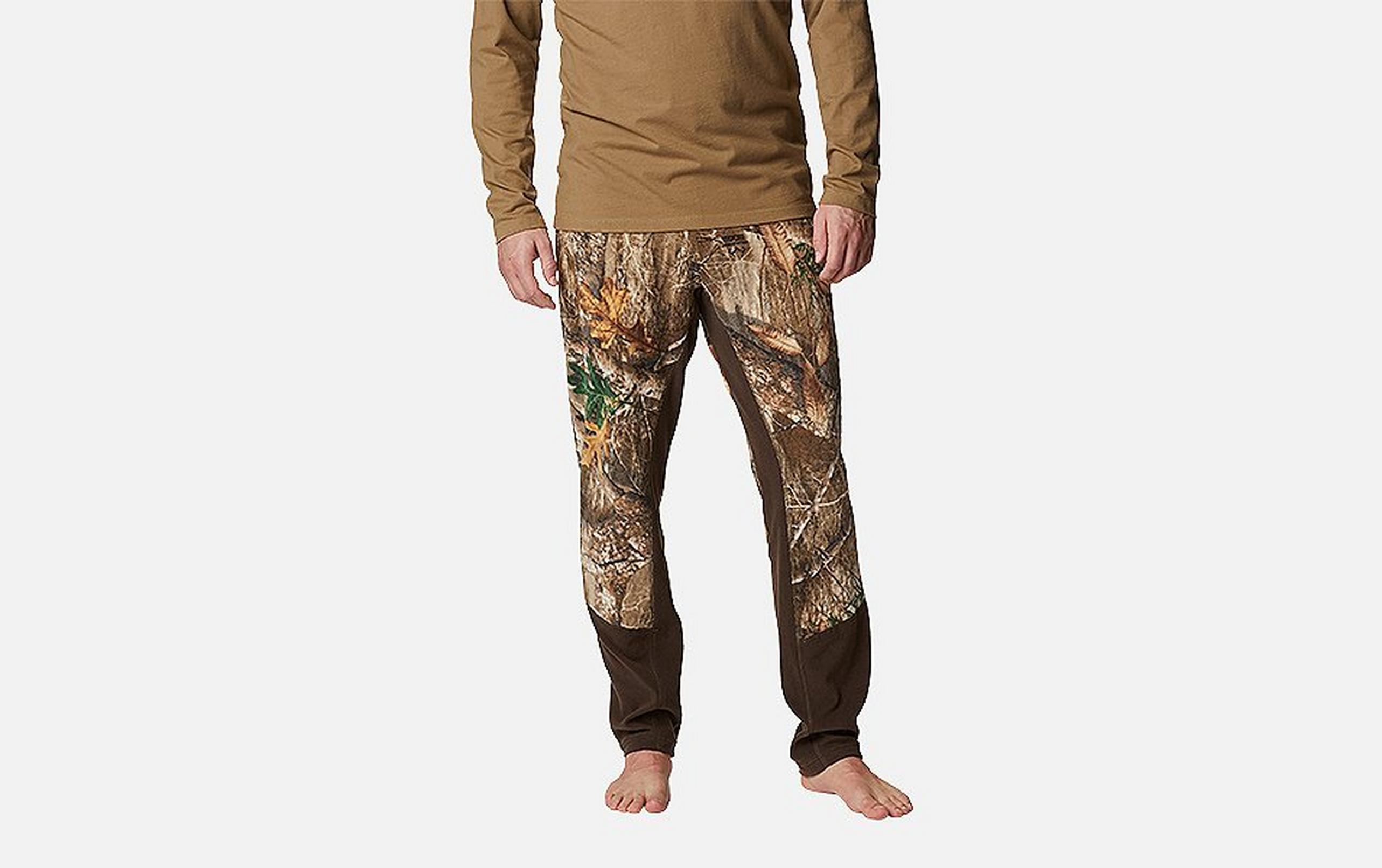 A product image of a woman wearing Columbia Sportswear’s PHG Tropy Rack Omni-Heat Helix Fleece Pants against a white background.  

​